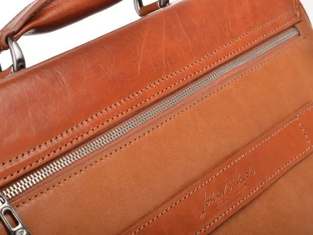 Camilla, the Queen, endorses upscale high street handbags, specifically a raffia model, which...