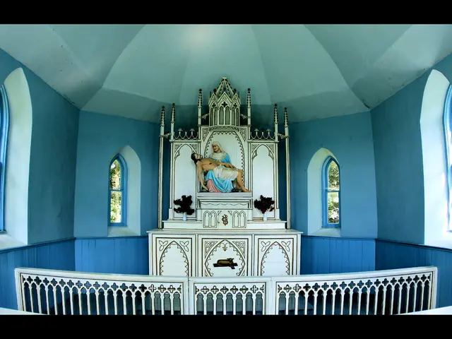 In this picture I can see statue of Jesus. This is an inside view of a church. Here I can see some...